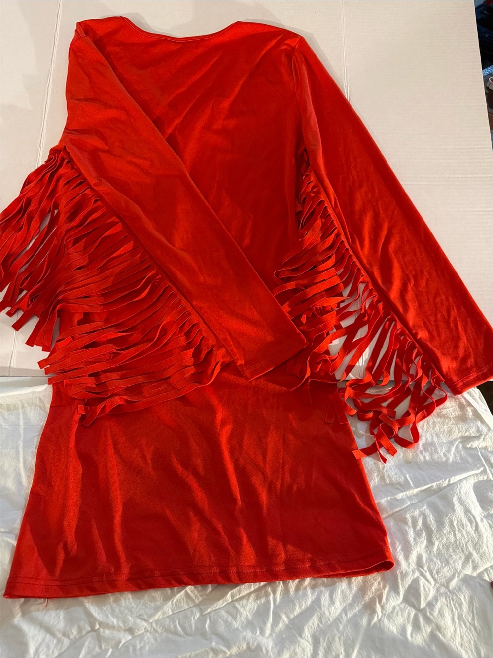 Beautiful red dress with fringe on both long sleeves